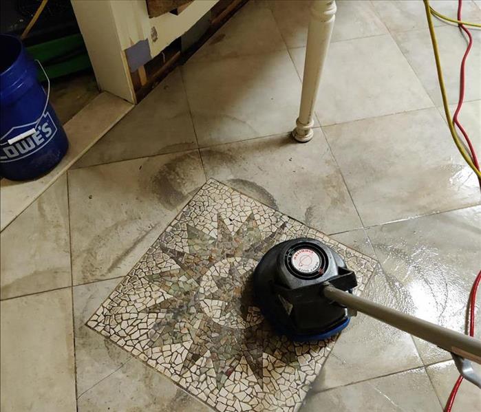 Patterned tile floor with SERVPRO cleaning equipment